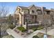 Charming multi-story home featuring a balcony, outdoor patio, and landscaped front yard at 9456 Rockhurst St # F, Highlands Ranch, CO 80129