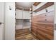 Custom walk-in closet with wood shelving and drawers offers ample storage space at 9456 Rockhurst St # F, Highlands Ranch, CO 80129