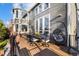 Relaxing back deck and patio area with outdoor seating, dining, and beautiful architectural views at 6155 Puma Pt, Lone Tree, CO 80124
