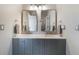 Bright bathroom featuring a double sink vanity with a white countertop, gray cabinets, and modern fixtures at 6155 Puma Pt, Lone Tree, CO 80124