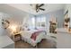 Cozy bedroom with carpet flooring, a ceiling fan and lots of light from the windows at 6155 Puma Pt, Lone Tree, CO 80124
