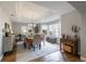 Elegant dining room featuring tray ceilings, large windows, and a modern chandelier for sophisticated meals at 6155 Puma Pt, Lone Tree, CO 80124
