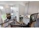 Bright living room with a fireplace, hardwood floors and tall windows for natural light at 6155 Puma Pt, Lone Tree, CO 80124