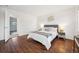 Spacious bedroom with wood-look flooring and an ensuite bathroom at 3288 S Dudley Ct, Lakewood, CO 80227