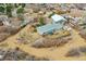 Aerial view of a home with a backyard, detached garage, deck, hot tub and surrounding neighborhood at 228 Birch Ave, Castle Rock, CO 80104