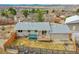 Backyard with a deck, hot tub, mature trees and partial fencing at 228 Birch Ave, Castle Rock, CO 80104