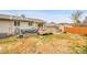Spacious backyard with a deck, hot tub, well-maintained lawn and neutral siding at 228 Birch Ave, Castle Rock, CO 80104