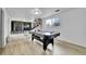 Finished basement with an air hockey table and a decorative stone fireplace at 228 Birch Ave, Castle Rock, CO 80104