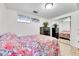 Bright bedroom with mirrored closet doors, dark dresser and natural light at 228 Birch Ave, Castle Rock, CO 80104