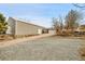 Property featuring a large multi-bay garage, parking area, and access to the home at 228 Birch Ave, Castle Rock, CO 80104