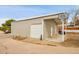 Large detached garage with a basketball hoop, multiple doors, and plenty of parking space at 228 Birch Ave, Castle Rock, CO 80104