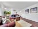 This living room features two brown couches, hardwood floors and decor at 228 Birch Ave, Castle Rock, CO 80104