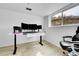 Bright office with triple monitors, white desk, natural light and neutral paint at 228 Birch Ave, Castle Rock, CO 80104