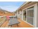 Relaxing outdoor patio with a hot tub, seating and sliding glass doors to indoor living space at 228 Birch Ave, Castle Rock, CO 80104
