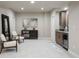 Finished basement area featuring seating area, kitchenette, and elegant decor at 23030 E Del Norte Cir, Aurora, CO 80016