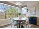 Bright dining area with large windows offering scenic views and a stylish chandelier at 23030 E Del Norte Cir, Aurora, CO 80016