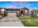Charming single-story home with stone accents and a two-car garage at 23030 E Del Norte Cir, Aurora, CO 80016