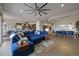 Bright living room with large sofa open to dining area and kitchen at 23030 E Del Norte Cir, Aurora, CO 80016