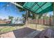 Spacious backyard with large shade tree and two-car detached garage with fenced perimeter at 444 S Jersey St, Denver, CO 80224