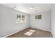 Cozy bedroom with plush carpeting, neutral walls, and bright, sunny windows for natural light at 444 S Jersey St, Denver, CO 80224