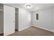 Comfortable bedroom features neutral walls, new carpeting, closet, and a sunny window at 444 S Jersey St, Denver, CO 80224