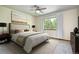 Comfortable bedroom with neutral tones, plush bedding, and a large window with natural light at 1313 Iris Cir, Broomfield, CO 80020