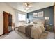 Bedroom with cool, blue accents and neutral bedding, showcasing a cozy and inviting atmosphere at 1313 Iris Cir, Broomfield, CO 80020