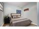 Cozy bedroom with neutral tones, carpeted floor, and a comfortable bed with plush pillows at 1313 Iris Cir, Broomfield, CO 80020