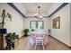 Elegant dining room with wood floors, stylish lighting, and a view of the backyard at 1313 Iris Cir, Broomfield, CO 80020