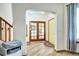 Elegant foyer with wood flooring and arched doorway leading to bright, sunny interior at 1313 Iris Cir, Broomfield, CO 80020