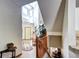Two-story foyer with hardwood floors, staircase, and ample natural light from clerestory windows at 1313 Iris Cir, Broomfield, CO 80020