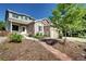 Inviting two-story home with landscaped front yard, brick accents, and a charming walkway at 1313 Iris Cir, Broomfield, CO 80020