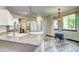 Bright kitchen and dining area with granite countertops and stainless steel appliances at 1313 Iris Cir, Broomfield, CO 80020