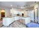 Well-lit kitchen featuring white cabinetry, granite counters, and modern appliances at 1313 Iris Cir, Broomfield, CO 80020