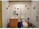 Small bathroom with a sink, toilet, and water heater, and minimal decor at 5910 Mccart Ranch Cir, Elizabeth, CO 80107