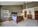 The spacious bedroom features nice lighting, multiple windows, and a large vaulted ceiling at 5910 Mccart Ranch Cir, Elizabeth, CO 80107