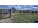 Exterior of a large dog pen, fenced-in area, and partial shelter at 5910 Mccart Ranch Cir, Elizabeth, CO 80107