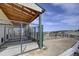Outdoor dog run and kennel featuring shelter, metal fencing, and access to the surrounding property at 5910 Mccart Ranch Cir, Elizabeth, CO 80107