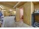 Interior view of a garage featuring shelving, workbench and plywood walls and ceiling at 5910 Mccart Ranch Cir, Elizabeth, CO 80107