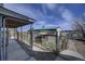 Fenced dog kennel with a shed and a nice view of the surrounding ranchland and blue skies at 5910 Mccart Ranch Cir, Elizabeth, CO 80107