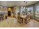 Inviting kitchen featuring wooden cabinets, modern appliances, and an adjacent dining area at 5910 Mccart Ranch Cir, Elizabeth, CO 80107