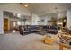 An expansive living area shows an open layout connecting to the kitchen and dining area at 5910 Mccart Ranch Cir, Elizabeth, CO 80107