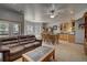 Inviting living room featuring a cozy sofa, dining table, wet bar, and ample seating for entertaining guests at 5910 Mccart Ranch Cir, Elizabeth, CO 80107
