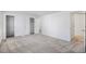 Spacious bedroom with closet storage and neutral carpeting at 6762 E Briarwood Dr, Centennial, CO 80112