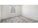 Bright bedroom with neutral carpet and a view from the window at 6762 E Briarwood Dr, Centennial, CO 80112