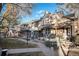 Inviting townhome with landscaped front yard and multiple entrances at 6762 E Briarwood Dr, Centennial, CO 80112