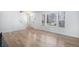 Open-concept living area with hardwood floors and ample natural light at 6762 E Briarwood Dr, Centennial, CO 80112