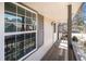 View of the exterior porch with wood floors and neutral paint with white trim at 6762 E Briarwood Dr, Centennial, CO 80112