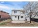 White two story house with a gray roof and a small shed in the backyard at 1663 W 135Th Way, Denver, CO 80234