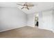Bedroom with carpet, vaulted ceilings, ceiling fan, and ensuite bath at 1663 W 135Th Way, Denver, CO 80234